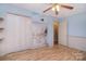 Cozy bedroom features a beach mural, closet and door at 6227 Dogwood Ln, Waxhaw, NC 28173