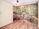 Bright room with wood floors and expansive nature scene wallpaper providing a tranquil aesthetic at 6227 Dogwood Ln, Waxhaw, NC 28173