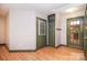 Welcoming entryway with beautiful wood floors, multiple doors, and neutral paint offering a bright, airy feel at 6227 Dogwood Ln, Waxhaw, NC 28173