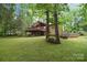 Inviting home with a spacious backyard, mature trees, and a charming deck, perfect for outdoor entertaining at 6227 Dogwood Ln, Waxhaw, NC 28173
