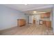Functional kitchen with modern light wood flooring, white appliances, and plenty of storage at 6227 Dogwood Ln, Waxhaw, NC 28173