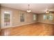 Bright living room with hardwood floors and a door leading to the outside deck at 6227 Dogwood Ln, Waxhaw, NC 28173