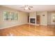 Living room with hardwood floors and a cozy fireplace at 6227 Dogwood Ln, Waxhaw, NC 28173