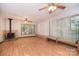 Spacious living room with wood floors, a fireplace, and large windows, perfect for entertaining at 6227 Dogwood Ln, Waxhaw, NC 28173