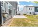 A view of the backyard with a patio and lush green grass, perfect for outdoor relaxation and entertainment at 711 Bellmouth Rd, Clover, SC 29710