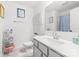 Bright bathroom featuring a white vanity, a modern faucet, and decorative wall art that enhances its appeal at 711 Bellmouth Rd, Clover, SC 29710
