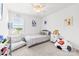Well-lit bedroom featuring neutral walls and carpet, decorated with colorful furniture and playful accents at 711 Bellmouth Rd, Clover, SC 29710