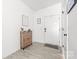 Bright entryway with wood-look floors, shoe cabinet, and stylish decor sets a welcoming tone at 711 Bellmouth Rd, Clover, SC 29710