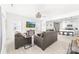 Open-concept living room flows into a modern kitchen with bar seating and contemporary appliances at 711 Bellmouth Rd, Clover, SC 29710