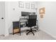 Functional office space with a black desk, ergonomic chair, and natural light at 711 Bellmouth Rd, Clover, SC 29710