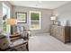 Cozy bedroom with neutral colors, comfortable seating, and a backyard view at 7137 Butternut Oak Ter, Huntersville, NC 28078