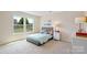 Bright bedroom with a large window and comfortable bed at 7137 Butternut Oak Ter, Huntersville, NC 28078