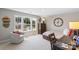 Bright bedroom with a large window, desk, chair, and comfortable bed at 7137 Butternut Oak Ter, Huntersville, NC 28078