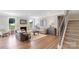 Inviting living room with a cozy fireplace, plush seating, and staircase access at 7137 Butternut Oak Ter, Huntersville, NC 28078