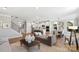Spacious open-concept living room showcasing a seamless blend of living, dining, and kitchen areas at 7137 Butternut Oak Ter, Huntersville, NC 28078