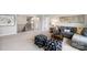 Upstairs loft with comfortable seating, stylish decor, and staircase access at 7137 Butternut Oak Ter, Huntersville, NC 28078
