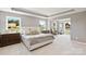 Spacious primary bedroom featuring trey ceiling, plush bedding, and ample natural light at 7137 Butternut Oak Ter, Huntersville, NC 28078