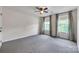 Bedroom featuring carpet flooring, ceiling fan and natural light from the windows at 8336 Early Bird Way, Mint Hill, NC 28227