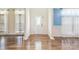 Bright foyer with hardwood floors, featuring decorative columns and natural light at 8336 Early Bird Way, Mint Hill, NC 28227