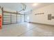 Spacious garage with epoxy flooring and ample room for parking and storage at 8336 Early Bird Way, Mint Hill, NC 28227