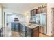 Kitchen featuring granite countertops, stainless steel appliances, and a wine fridge at 8336 Early Bird Way, Mint Hill, NC 28227
