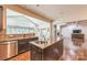 View of kitchen with stainless appliances and granite countertops overlooking living room at 8336 Early Bird Way, Mint Hill, NC 28227