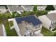Aerial view of a home with solar panels, showcasing neighborhood and property at 8511 Redding Glen Ave, Charlotte, NC 28216