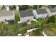 Aerial view of backyard showing the lawn, fence, patio, and privacy offered by the mature landscaping at 8511 Redding Glen Ave, Charlotte, NC 28216