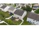 Aerial view of backyard with lawn and trampoline, surrounded by a white picket fence at 8511 Redding Glen Ave, Charlotte, NC 28216