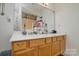 Bathroom featuring dual sinks, quartz countertop and neutral cabinetry at 8511 Redding Glen Ave, Charlotte, NC 28216