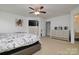 Spacious bedroom with neutral tones featuring a ceiling fan, and TV at 8511 Redding Glen Ave, Charlotte, NC 28216