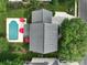 Aerial view of a home with a pool, lush landscaping, and a well-maintained yard at 8612 Tintinhull Ln, Waxhaw, NC 28173