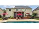 Spacious backyard featuring a pool, patio, and screened-in porch for outdoor enjoyment at 8612 Tintinhull Ln, Waxhaw, NC 28173