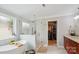 Elegant bathroom featuring a soaking tub, walk-in shower, and access to a walk-in closet at 8612 Tintinhull Ln, Waxhaw, NC 28173