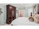 Spacious bedroom with traditional furniture, including armoire, complements the room's neutral palette at 8612 Tintinhull Ln, Waxhaw, NC 28173
