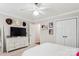 Cozy bedroom featuring neutral walls, a ceiling fan, and a double-door closet at 8612 Tintinhull Ln, Waxhaw, NC 28173