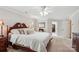 Comfortable bedroom featuring a wooden bed, a closet, and soft, neutral tones at 8612 Tintinhull Ln, Waxhaw, NC 28173