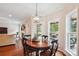 Dining area featuring a round wood table, seating for four, and natural light at 8612 Tintinhull Ln, Waxhaw, NC 28173