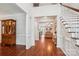 Bright foyer with hardwood floors, white trim, and an open staircase leading to the second floor at 8612 Tintinhull Ln, Waxhaw, NC 28173