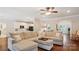 Bright and airy living room boasts a plush sectional sofa and seamless flow to the kitchen at 8612 Tintinhull Ln, Waxhaw, NC 28173