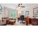 Spacious home office with two computer monitors, comfortable seating, and a window with natural light at 8612 Tintinhull Ln, Waxhaw, NC 28173