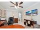 Home office with a round table, desk, a brown shelf and a comfortable black rolling chair at 8612 Tintinhull Ln, Waxhaw, NC 28173