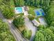 Aerial view of the community pool, tennis courts, and facilities, offering residents a resort-style experience at 8700 Thornbury Ln, Huntersville, NC 28078