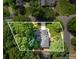Aerial view showcasing the property's expansive lot, mature trees, and well-manicured landscaping at 8700 Thornbury Ln, Huntersville, NC 28078