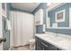 Cozy bathroom with a shower-tub combo and updated vanity, perfect for everyday convenience at 8700 Thornbury Ln, Huntersville, NC 28078