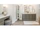 Stylish bathroom featuring double sinks, a makeup vanity, updated fixtures, and modern design for your everyday convenience at 8700 Thornbury Ln, Huntersville, NC 28078