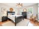 Relaxing bedroom with a rocking chair, hardwood floors, and natural light creating a soothing space at 8700 Thornbury Ln, Huntersville, NC 28078