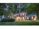 Beautiful brick home with well-manicured lawn and inviting entrance exudes classic charm and curb appeal at 8700 Thornbury Ln, Huntersville, NC 28078