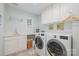 Bright laundry room with modern washer and dryer, offering convenience for your laundry needs at 8700 Thornbury Ln, Huntersville, NC 28078