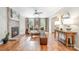 Cozy living room with a brick fireplace, hardwood floors, and neutral decor at 8700 Thornbury Ln, Huntersville, NC 28078